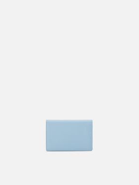 Light blue smooth leather card holder with metal logo