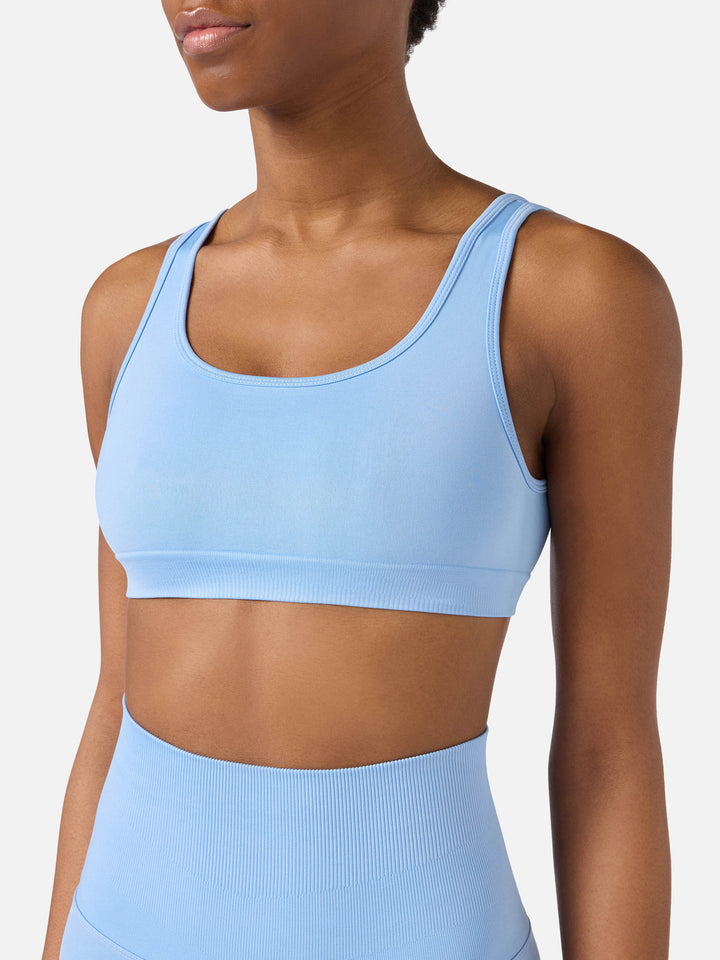 Top sportivo Fify azzurro in tessuto tecnico  con profili a contrasto