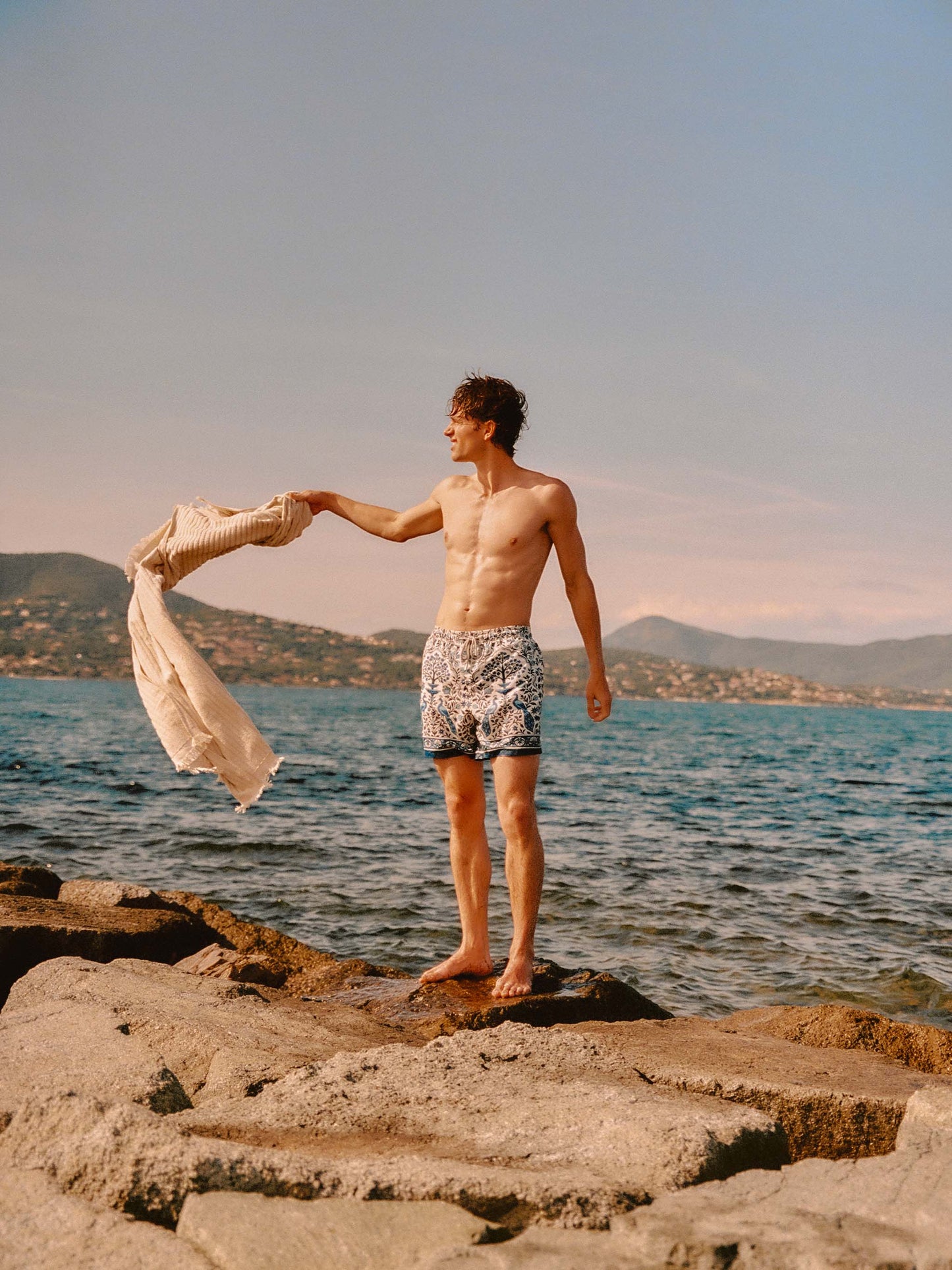 Gustavia white swim shorts with contrasting peacock print