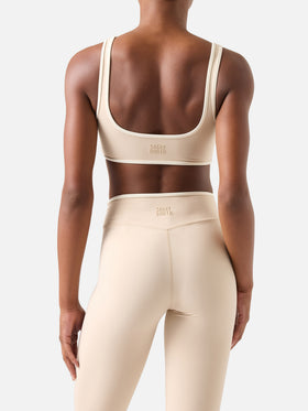 Top fitness Kassie beige con ribetes en contraste 