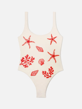 Maillot de bain une-pièce Lora en coloris crème avec décorations perlées sur le thème de la mer 