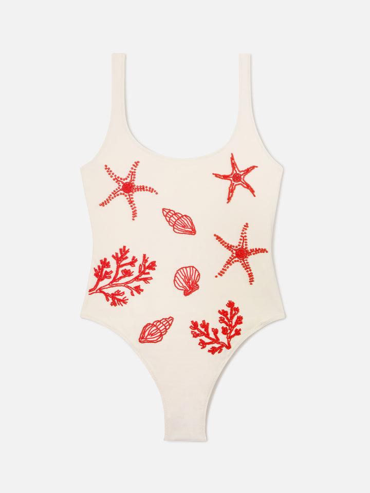 Lora one-piece swimsuit in cream with beaded sea-themed decorations