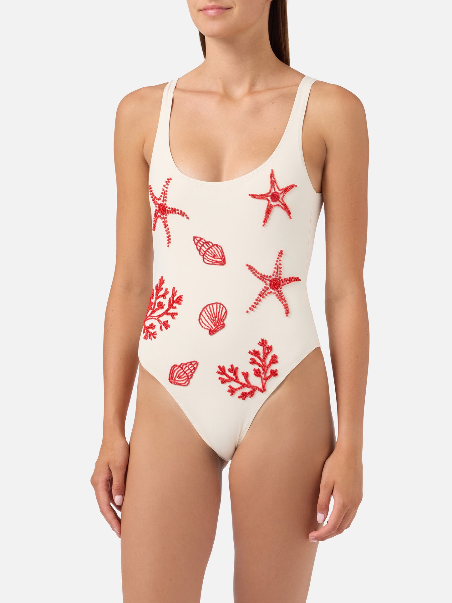 Maillot de bain une-pièce Lora en coloris crème avec décorations perlées sur le thème de la mer 