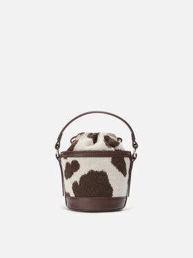 Mila Tweed Bucket Bag aus Tweed-Wollmischung mit Kuhfellmuster.