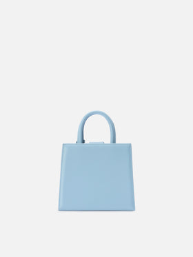 Mini bag Structured Shop en piel lisa azul claro con etiqueta metálica 