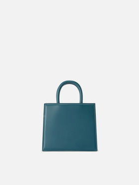 Mini bag Structured Shop en piel lisa verde teal con etiqueta metálica 
