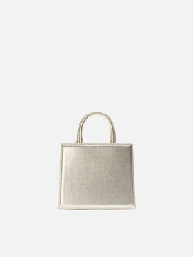 Mini bag Structured Shop en piel laminada dorada con etiqueta metálica 