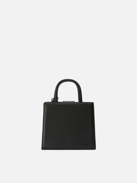 Mini bag Structured Shop en piel lisa negra con placa metálica 