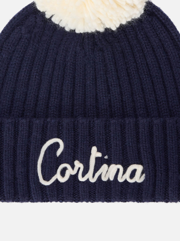 Marineblaue blue Wengen-Mütze mit Bommel und Cortina-Stickerei 