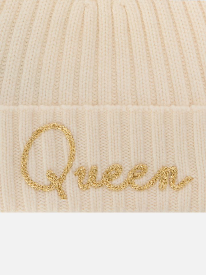 Bonnet Wengen écru avec pompon et broderie Queen 